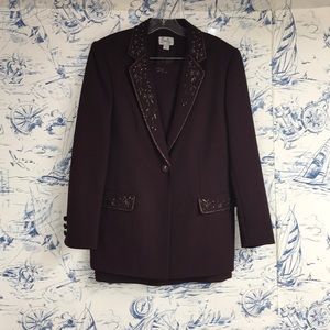 After five even suit with suit jacket and skirt.